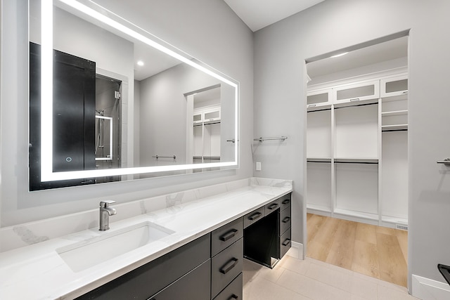 bathroom with vanity and walk in shower