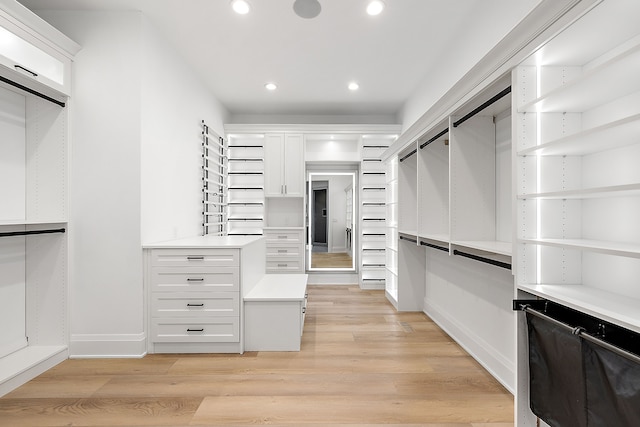 spacious closet featuring light hardwood / wood-style floors