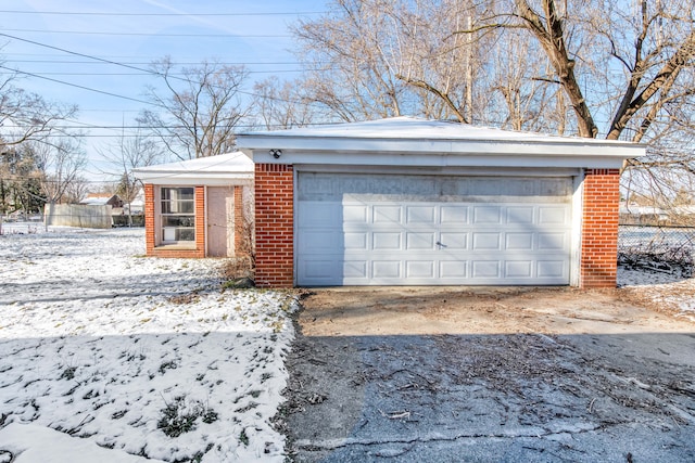 view of snow covered garage