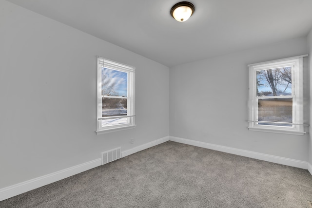 spare room with light colored carpet