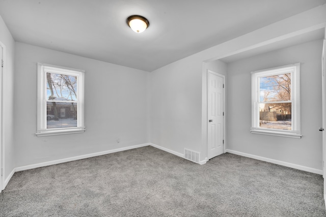 spare room with carpet floors