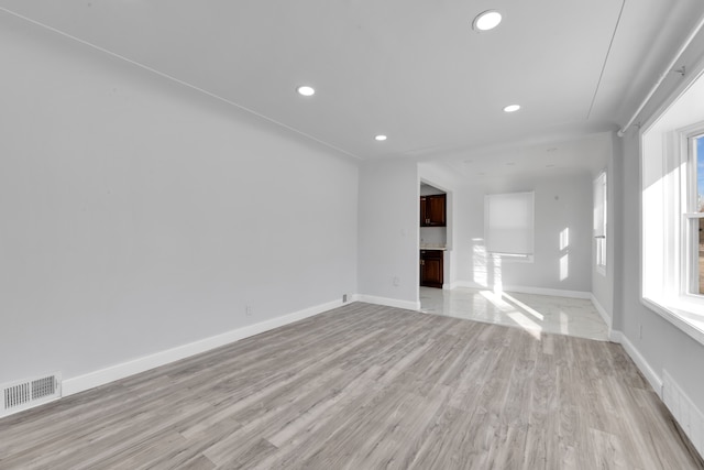 unfurnished living room featuring light hardwood / wood-style flooring