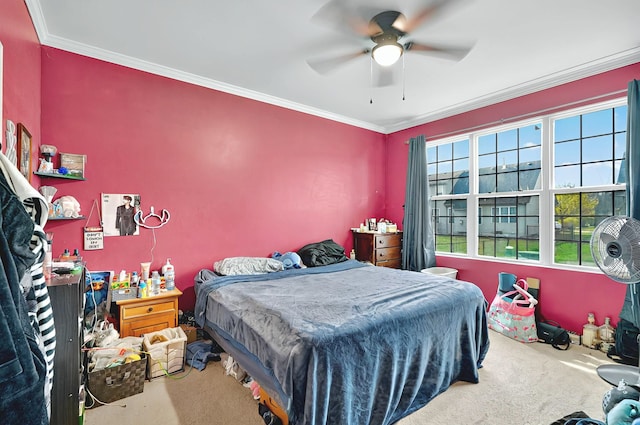 bedroom featuring carpet flooring, a ceiling fan, and ornamental molding