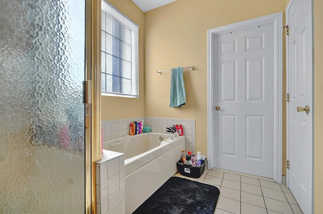 bathroom featuring a bath, a shower with shower door, and tile patterned floors