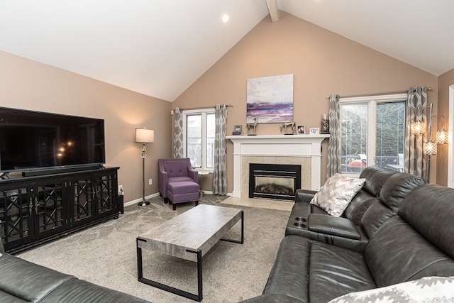 living room with a tiled fireplace, high vaulted ceiling, light colored carpet, and beam ceiling