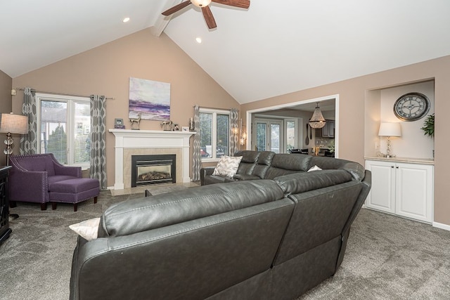 living room featuring beam ceiling, high vaulted ceiling, carpet flooring, ceiling fan, and a fireplace