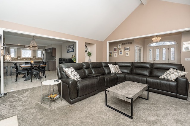 living room featuring a notable chandelier, tile patterned floors, high vaulted ceiling, and beamed ceiling