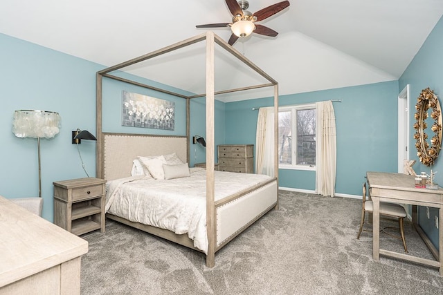 bedroom with lofted ceiling and carpet floors