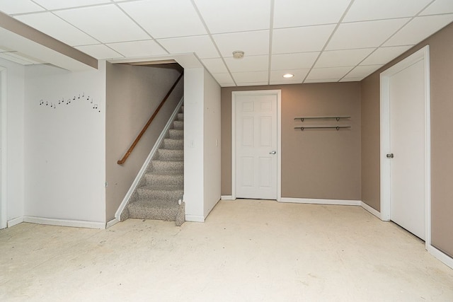 basement with a paneled ceiling