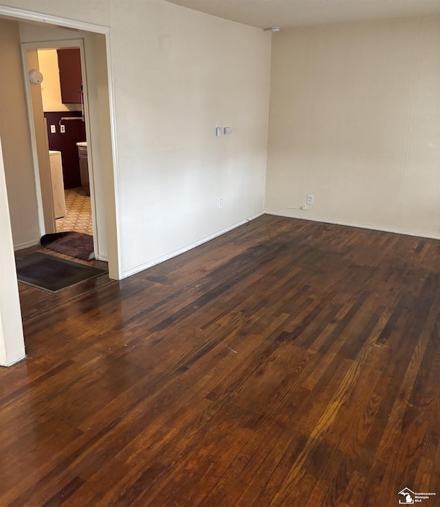 empty room featuring dark hardwood / wood-style floors