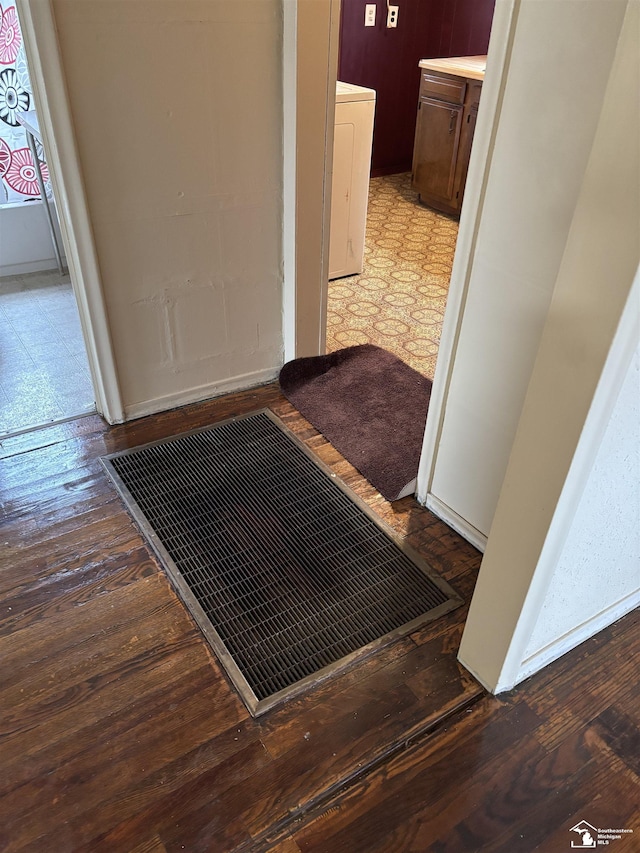 corridor with wood-type flooring