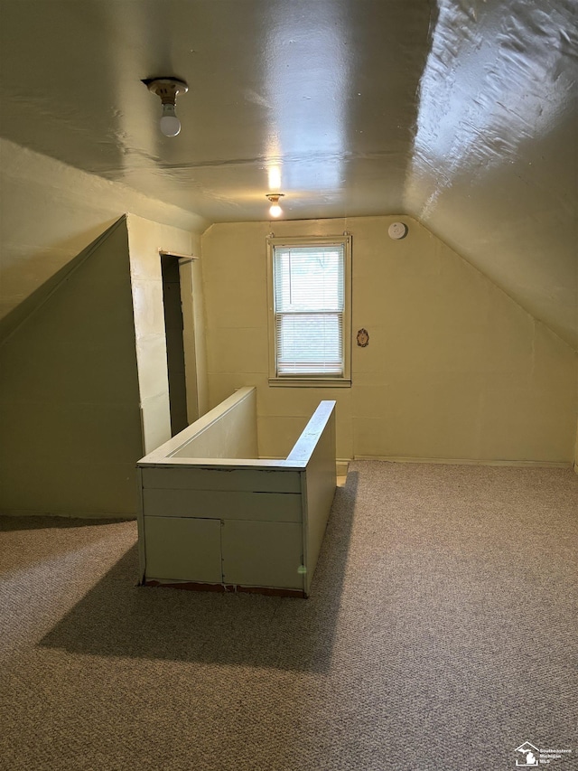 bonus room featuring carpet flooring and lofted ceiling