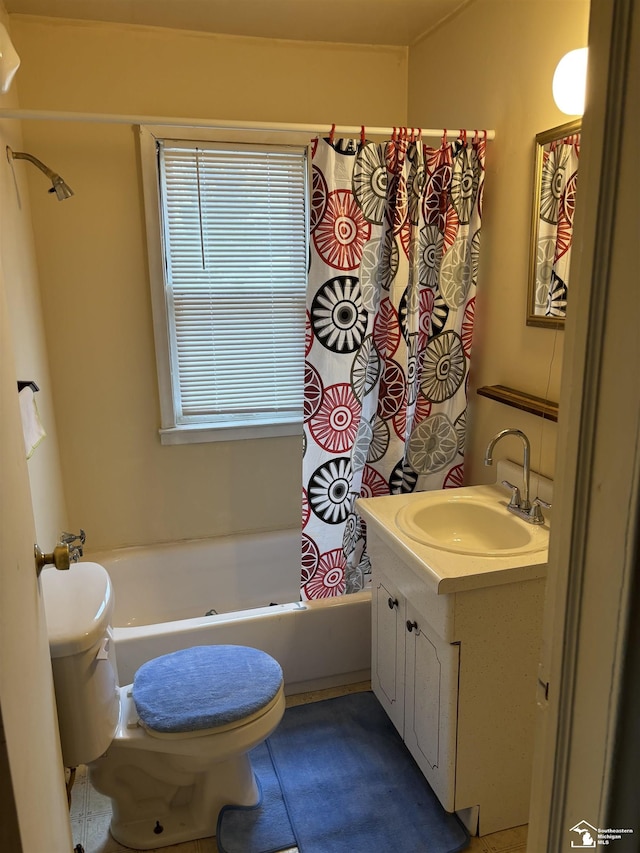 full bathroom with shower / bath combo with shower curtain, vanity, and toilet