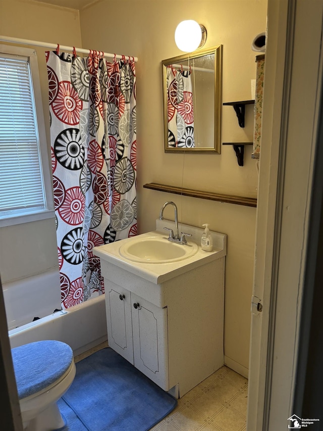 full bathroom featuring vanity, toilet, and shower / bath combo with shower curtain