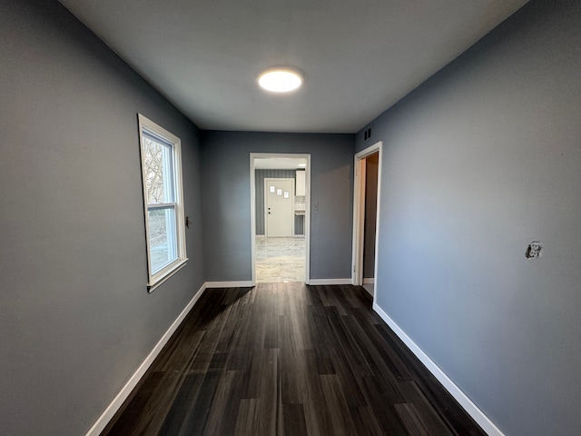 hall featuring dark wood-type flooring