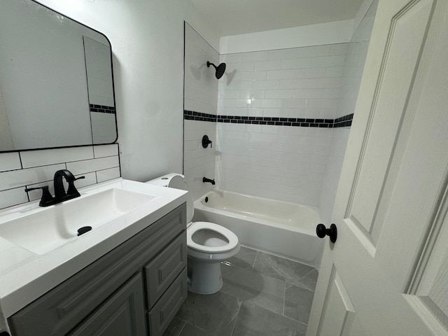 full bathroom featuring vanity, backsplash, toilet, and tiled shower / bath