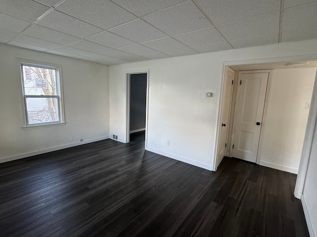 unfurnished room with dark hardwood / wood-style floors