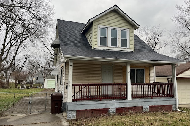 view of front of home featuring a porch and a garage