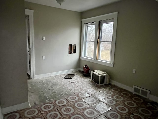 empty room featuring plenty of natural light