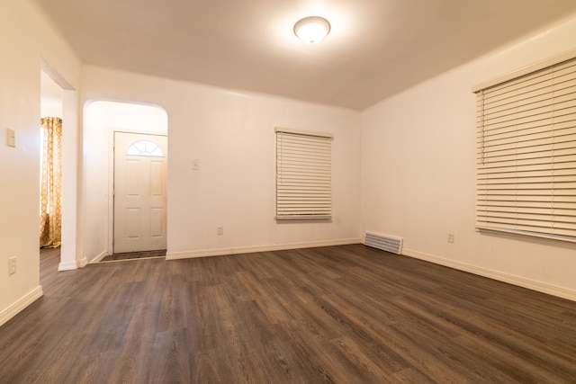 spare room with dark hardwood / wood-style floors