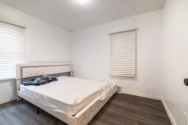 bedroom featuring dark wood-type flooring