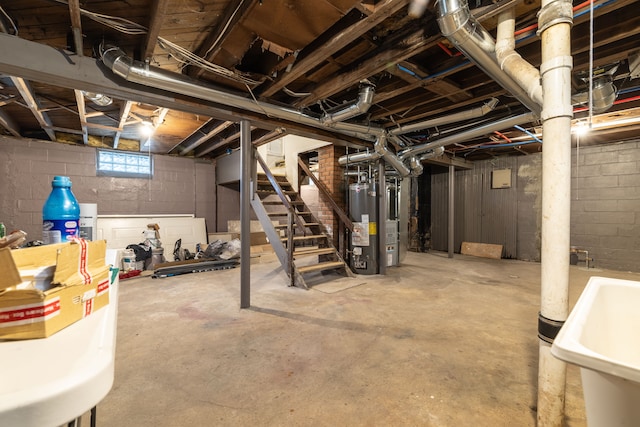 basement featuring water heater and sink