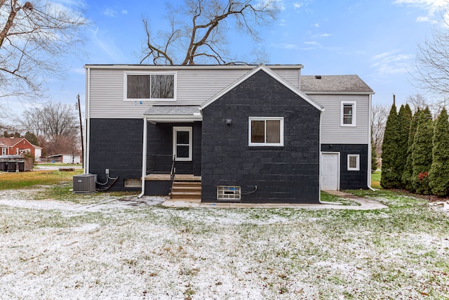 back of property featuring central AC unit