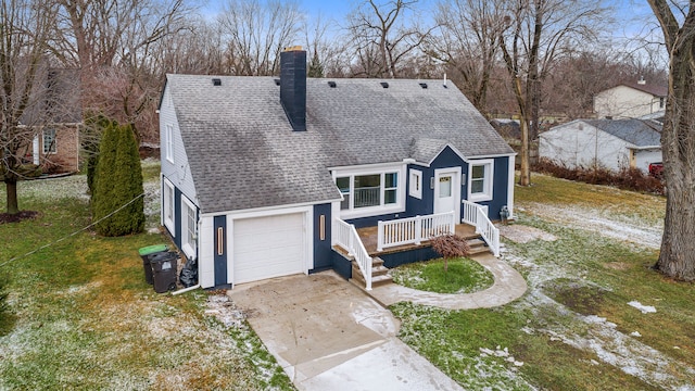 view of front of house featuring a garage and a front lawn