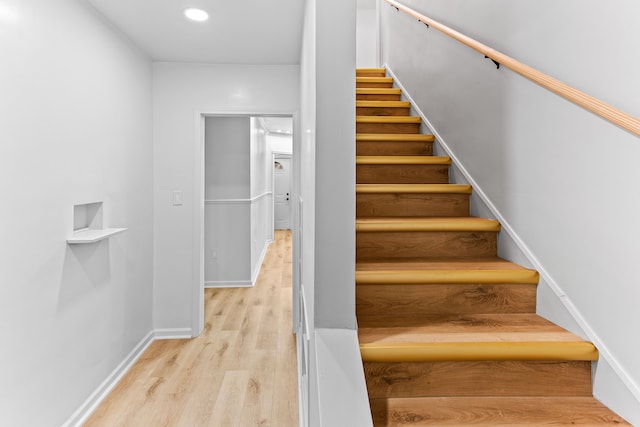 stairway with wood-type flooring