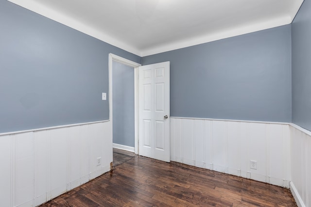 empty room with dark hardwood / wood-style floors