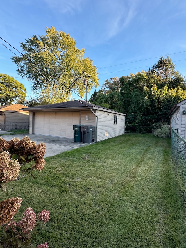 view of side of home with a lawn, an outdoor structure, and a garage