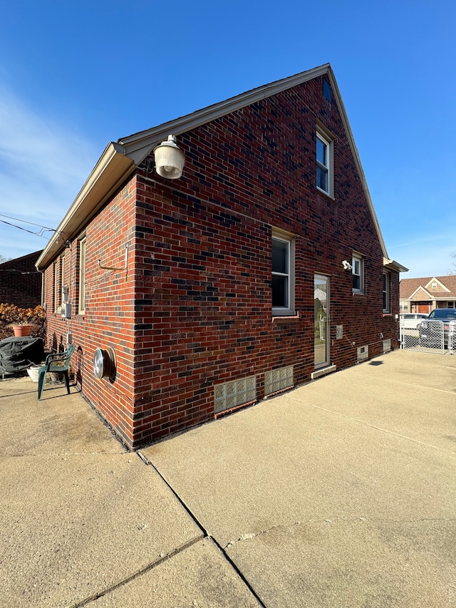 view of side of property featuring a patio