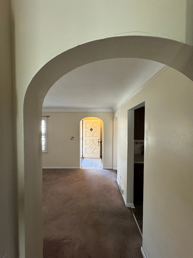 hall featuring carpet flooring