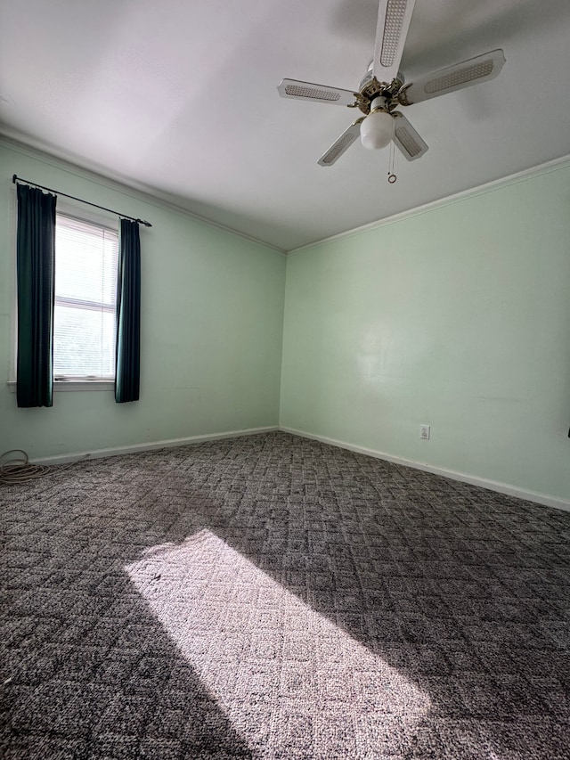 empty room featuring carpet, ceiling fan, and ornamental molding