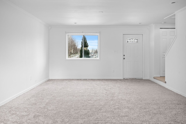 interior space with carpet flooring and ornamental molding