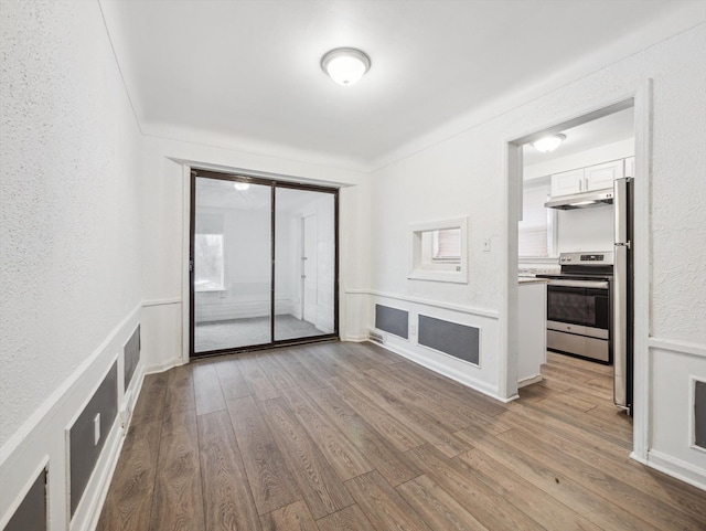 spare room featuring light hardwood / wood-style floors