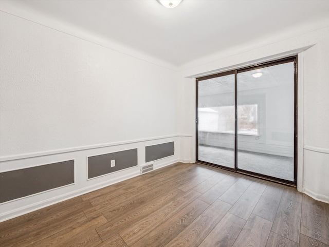 empty room featuring wood-type flooring