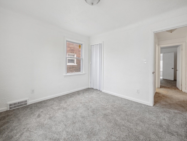 spare room featuring carpet floors