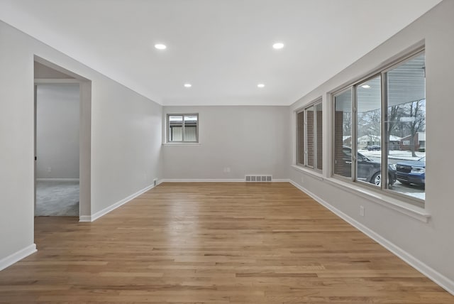 unfurnished room featuring light hardwood / wood-style floors