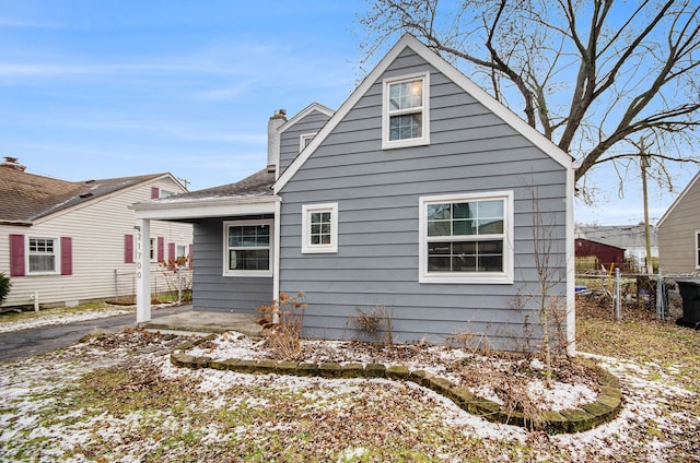 view of snow covered house