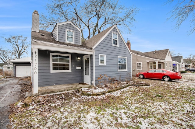 cape cod house with a garage