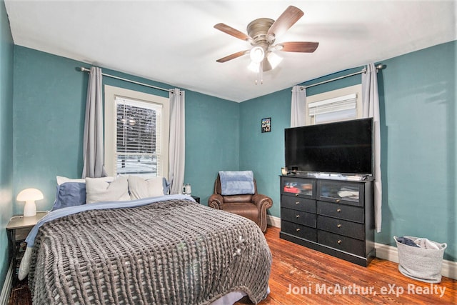 bedroom with ceiling fan and hardwood / wood-style floors