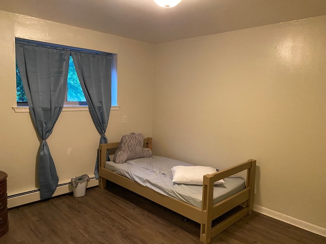 bedroom with dark wood-type flooring