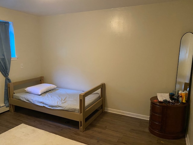 bedroom featuring dark wood-type flooring