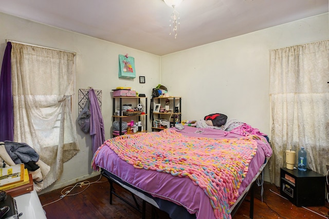 bedroom featuring dark hardwood / wood-style flooring