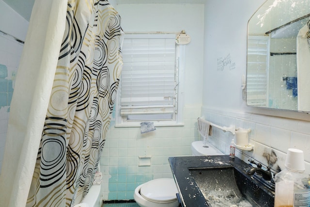 full bathroom featuring shower / tub combo, toilet, tile walls, and sink