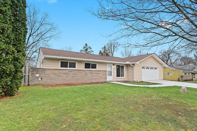 ranch-style house featuring a garage and a front lawn