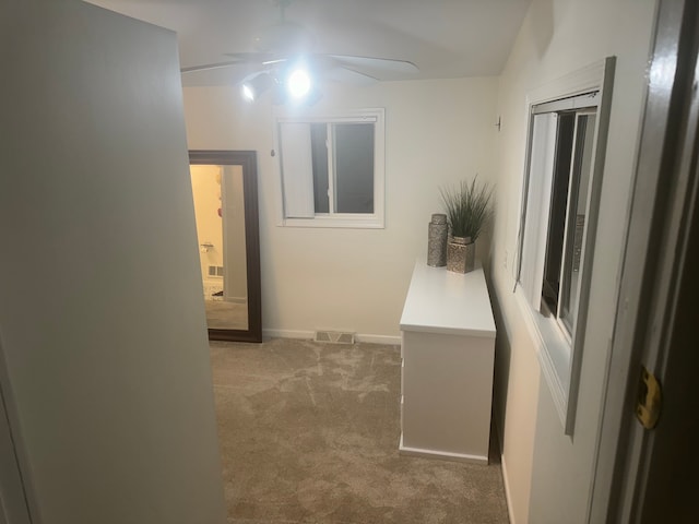 corridor with carpet flooring and lofted ceiling