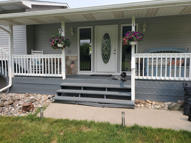 property entrance with covered porch