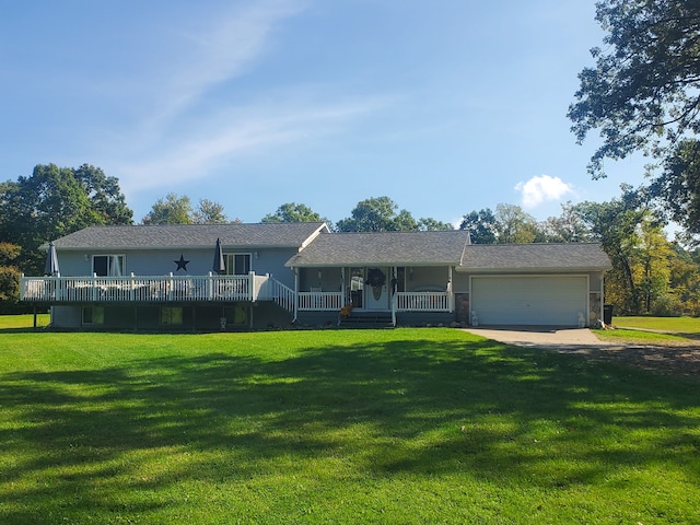 single story home with a porch, a garage, and a front yard